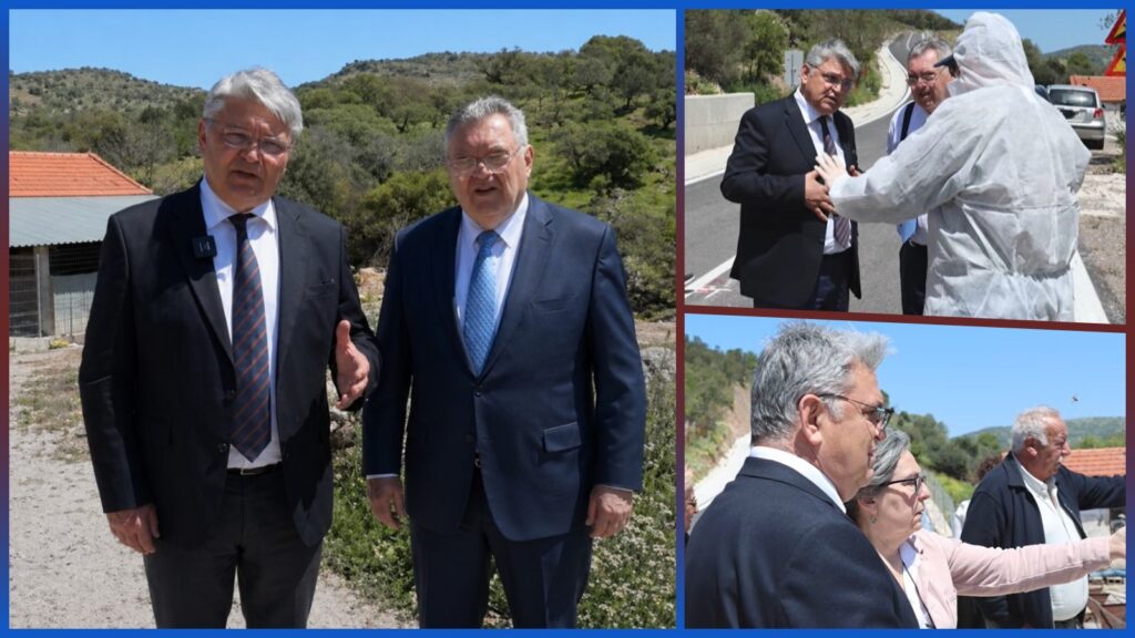 Ο Δημήτρης Νατσιός σε επίσκεψη σε κτηνοτροφική μονάδα στη Λέσβο, συνομιλεί με κτηνοτρόφους δίπλα σε στάβλους και ζώα σε αγροτική περιοχή